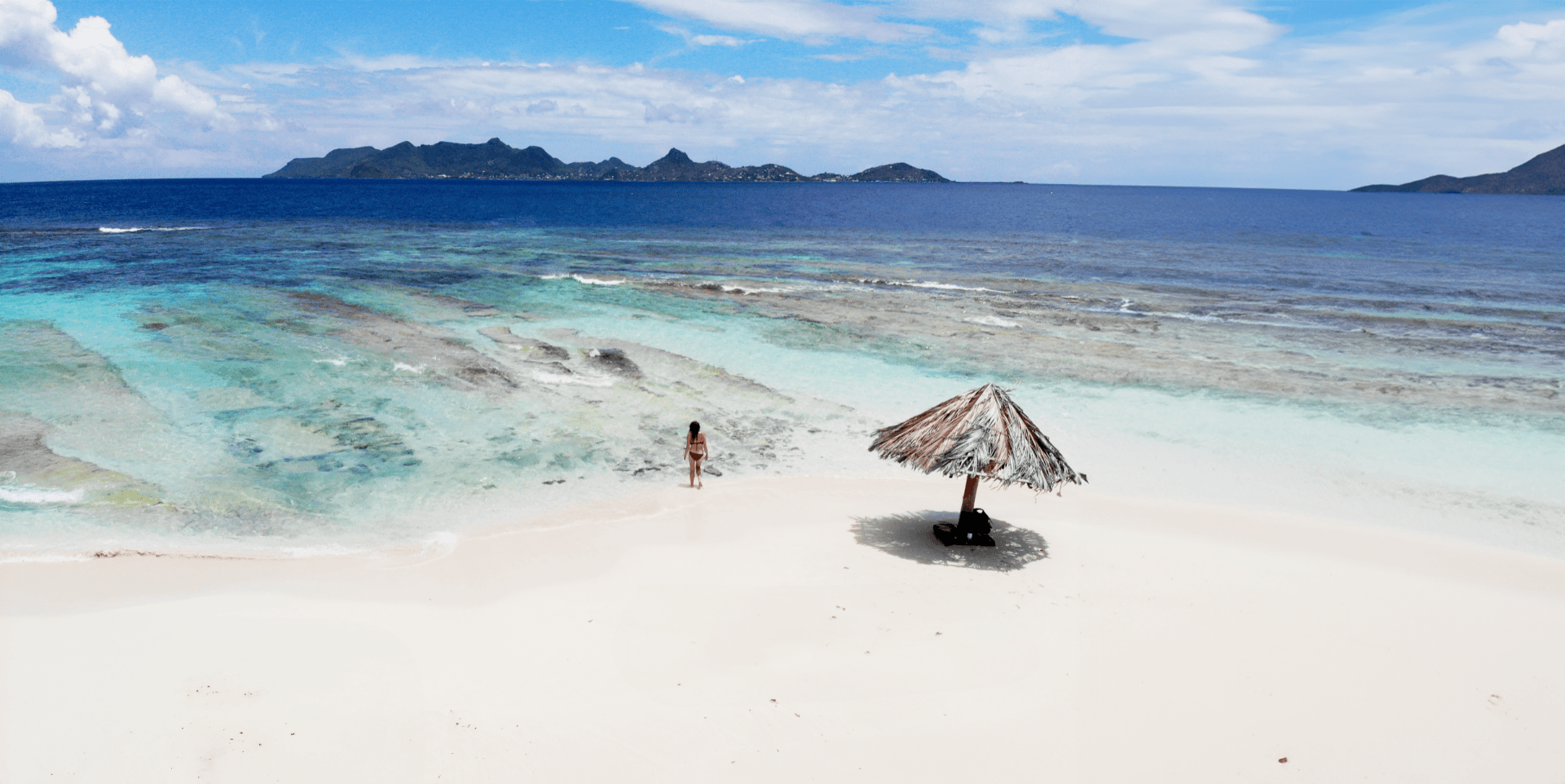 Bright sky over a turquoise sea