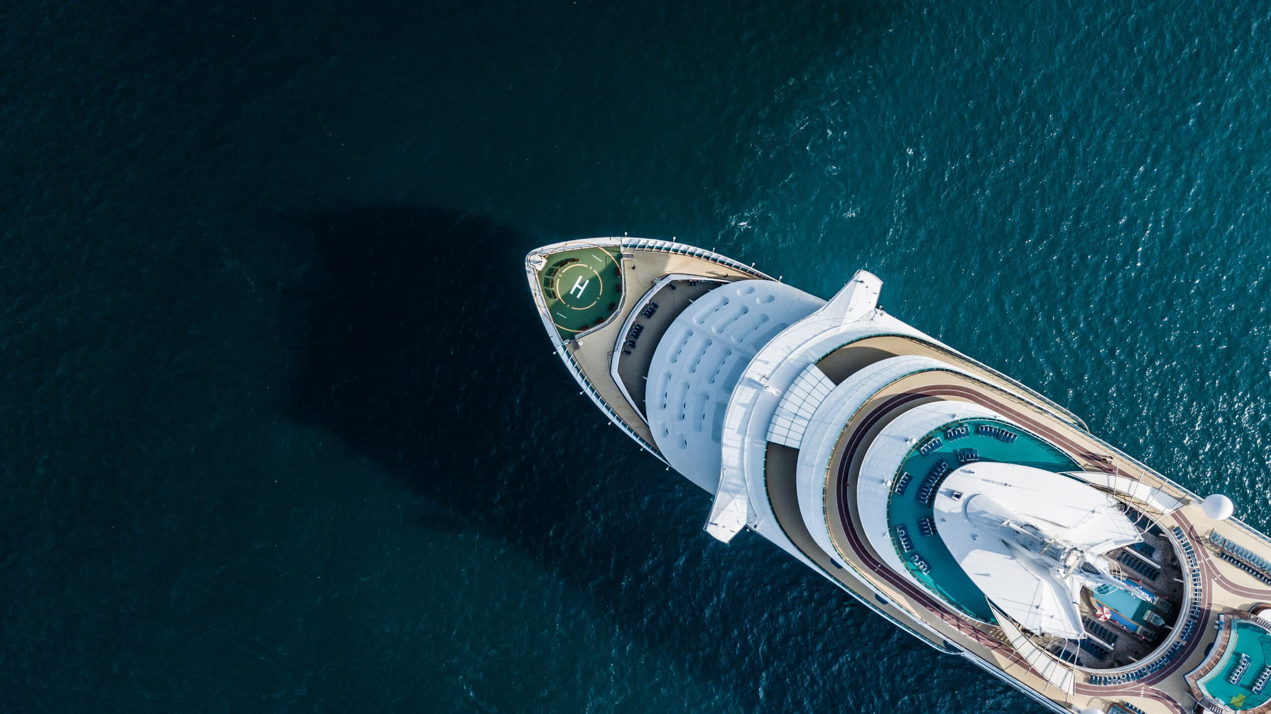 Aerial view of a cruise ship bow in deep blue water